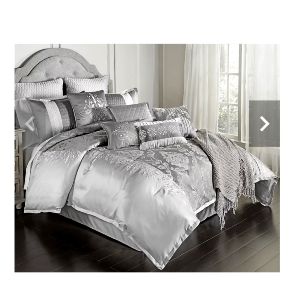 Brand new Queen Gray comforter set with decorative pillows included.